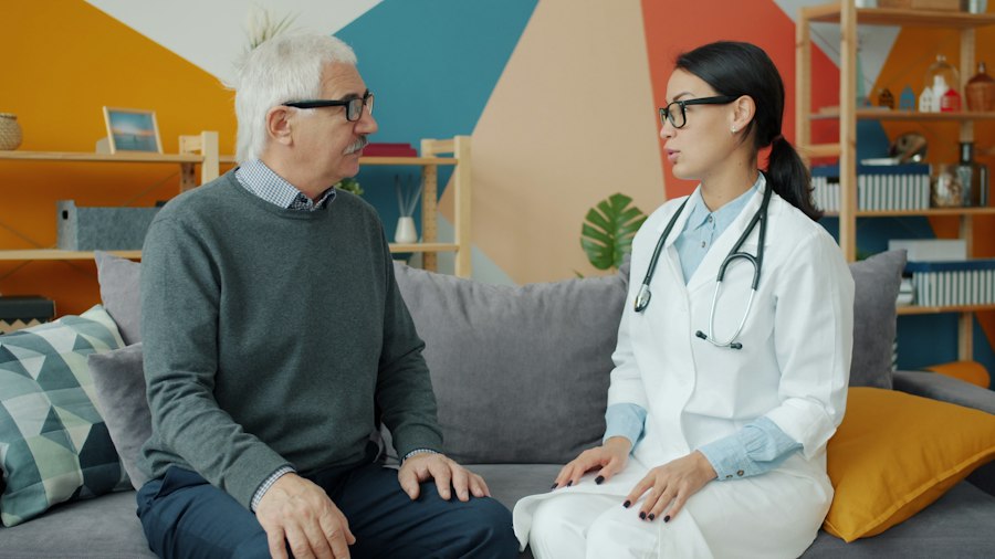 Doctor consulting an elderly man at home